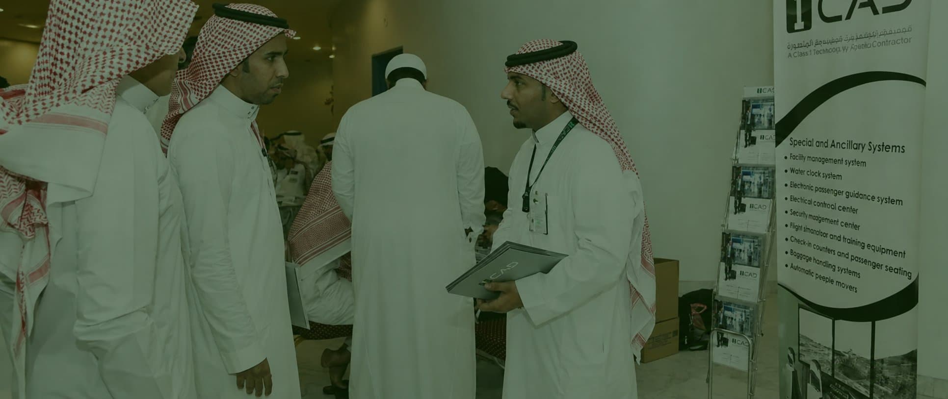 ICAD staff talking with visitors beside the company stand at an exhibition